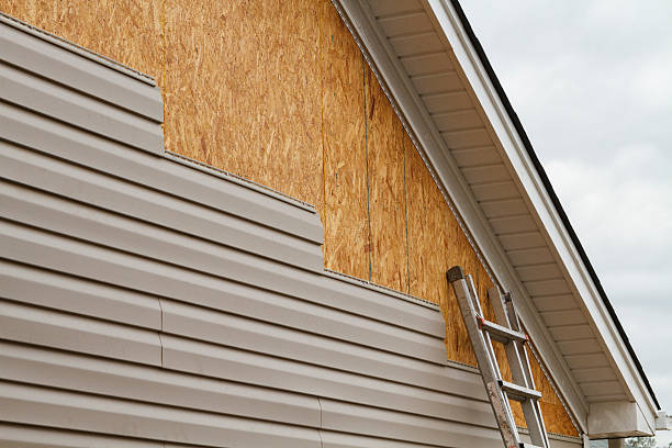 Professional Storm Damage Siding Repair technician working in Westfield, PA